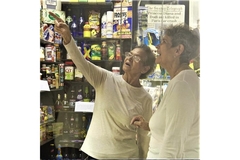 Image Old women pointing at brands in a store.